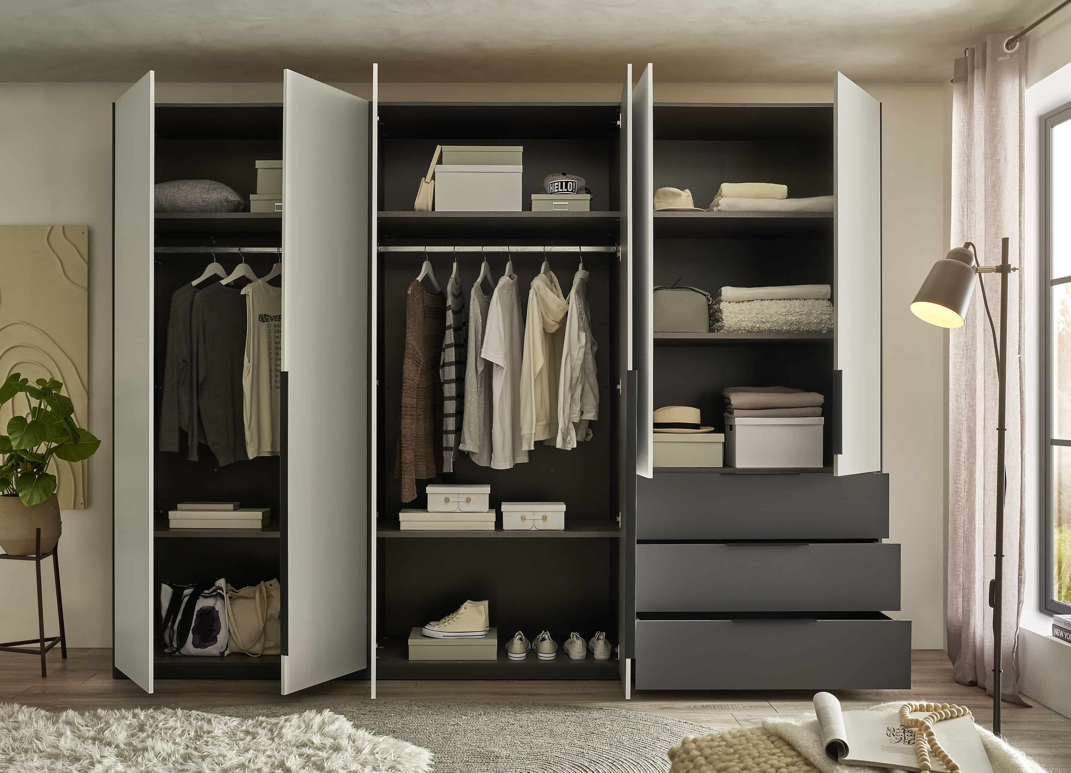 Nuka Kleiderschrank graphitgrau/hellgrau – 300 cm breit, mit Schubladen & Drehtüren, modernes Design Nuka Kleiderschrank graphitgrau/hellgrau – 300 cm breit, mit Schubladen & Drehtüren, modernes Design